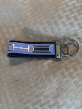 Load image into Gallery viewer, Keychain, Silver snaffles on purple ribbon.